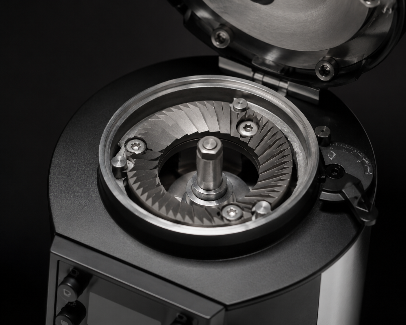 Close-up of a mechanical component with gears and metal parts on a black background